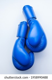 Boxing Gloves In Blue On A White Background. View From Above.