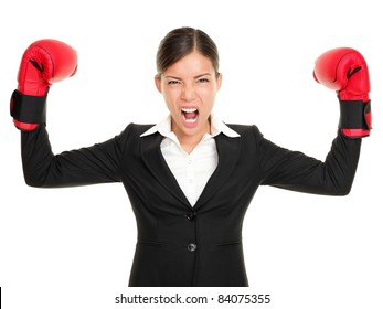 Boxing gloves business woman angry - business concept showing aggressive female businessperson flexing muscles wearing boxing gloves isolated on white background. Mad multiracial businesswoman. - Powered by Shutterstock