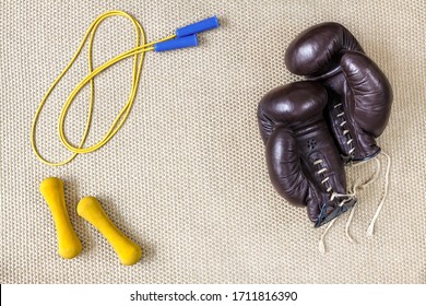 Boxing Gloves Jump Rope Dumbbells On A Mat, Flat Lay