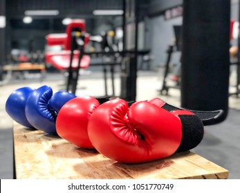 Boxing Gloves On Wood Table In Fitness Gym