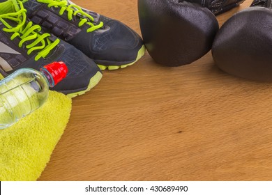 Boxing gloves, a towel and water. All fitness