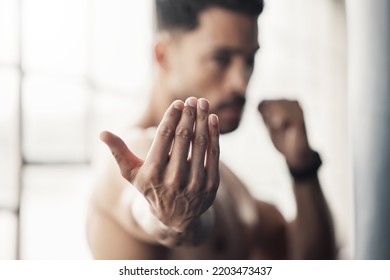Boxing hands gesture, strong man and fight training of mma athlete, fitness power and sports gym champion. Zoom palm of boxer in fighting stance to approach, attack and impact for karate martial arts