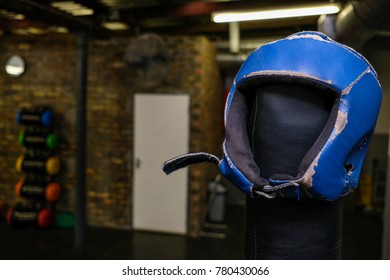 Boxing Head Guard Stored On Top Of A Boxing Ring Post