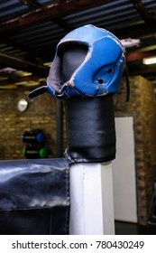 Boxing Head Guard Stored On Top Of A Boxing Ring Post