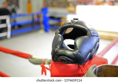 Boxing helmet at corner of box ring - Shutterstock ID 1374659114