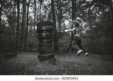 Boxing Homemade Pear, Made From Car Tires. Fighter Fulfills Kick.