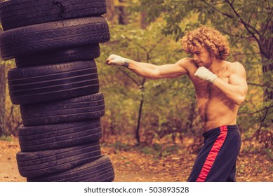 Boxing Homemade Pear, Made From Car Tires. Fighter Fulfills Kick.