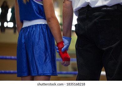 Boxing Judge Holds Girls Hand Before Announcing A Winner In A Competition