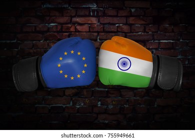 A Boxing Match. Confrontation Between The European Union And India. Indian And EU, EC National Flags On Boxing Gloves. Sports Competition Between The Two Countries. Concept Foreign Policy Conflict.