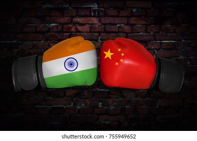 A Boxing Match. Confrontation Between The India And China. Indian And Chinese National Flags On Boxing Gloves. Sports Competition Between The Two Countries. Concept Of The Foreign Policy Conflict