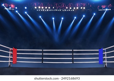 Boxing ring with ropes with blue spotlights and smoke. Boxing tournament for the championship. Boxing Championship. Fight night - Powered by Shutterstock