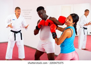 Boxing Sparring Men And Women At Training In A Sports Club