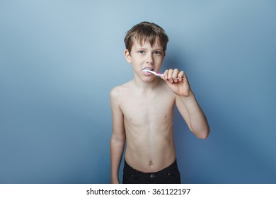 a boy of 10 years of European appearance naked  torso brushing  