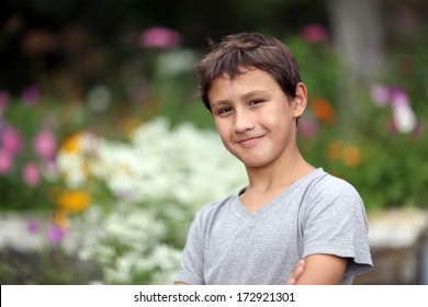 Boy 10 Years Old Against Summer Flower