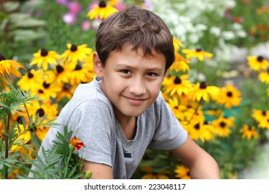 Boy 10 Years Old Against Summer Flower