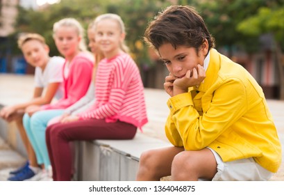 Boy 8-11 Years Old Is Outlaw From His Friends In The Park.