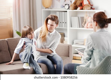 Boy with ADHD and his worried mother during a meeting with therapist