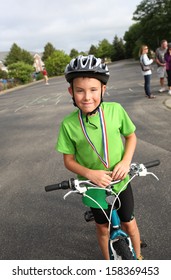 Boy After Finishing A Kids Triathlon