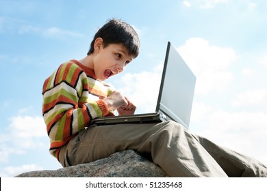 A boy is angry with the results of the computer game - Shutterstock ID 51235468
