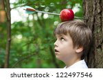 boy with apple on his  head and arrow shot through