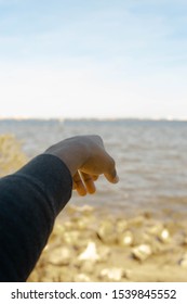 Boy With Arm Outstretched In front Of Camera 