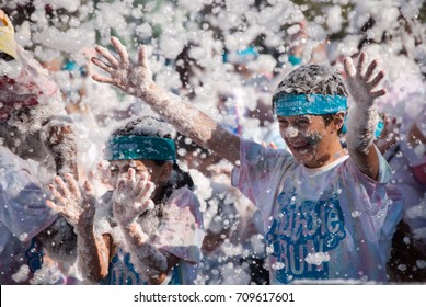 Boy with arms raised gets blasted with a bubble cannon at finish line. Bubble Run, Charity Fund raising event, August 2017, Everett Washington USA