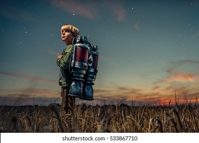 Boy with a backpack at night