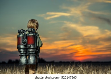 Boy with a backpack at sunset
