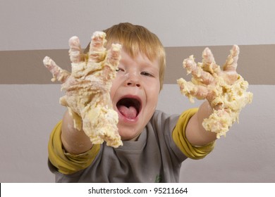  Boy Baking Cookies At Christmastime - With Sticky Hands Full Of Dough