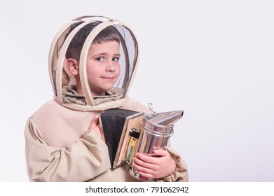 Boy In Beekeeper's Suits Posing In Studio White Background.