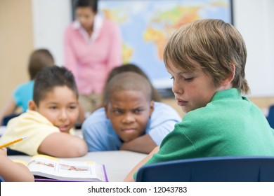 Boy Being Bullied In Elementary School Classroom