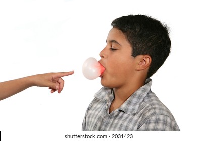 A Boy Blowing A Bubble With His Gum