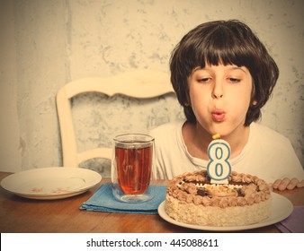 Boy Blowing Out Candles On Birthday Cake. Digital Eight. Eight Birthday. Celebration. Instagram Image Filter Retro Style