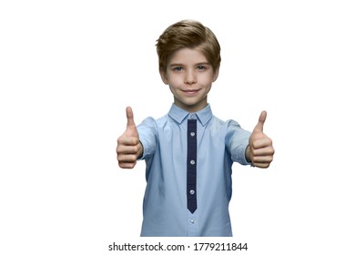 Boy In Blue Shirt Showing Okay With Both Hands On White Background. Smiling Kid Male With Outstretched Arms.