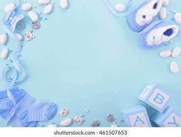Its a boy, blue theme Baby Shower or Nursery background with decorated borders on pale blue wood background.