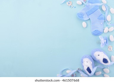 Its a boy, blue theme Baby Shower or Nursery background with decorated borders on pale blue wood background.