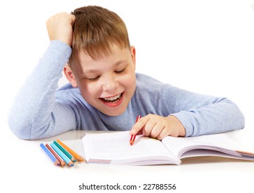 The boy with the book behind a table