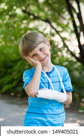  Boy With A Broken Arm In Park