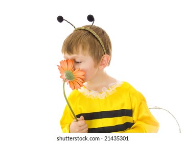 Boy In Bumble Bee Costume Smelling Red Flower