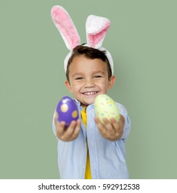 A Boy With Bunny Hairband And Easter Eggs