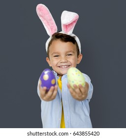 A Boy With Bunny Hairband And Easter Eggs