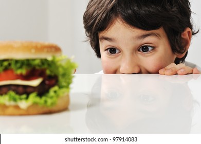 Boy and burger - Powered by Shutterstock