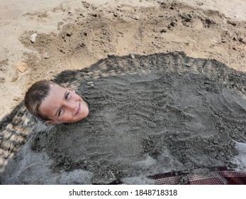 Boy Buried In The Sand