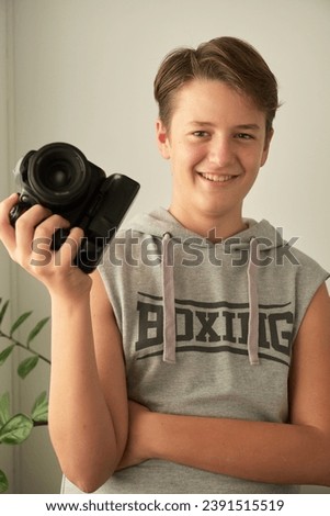 a boy with camera in his hands