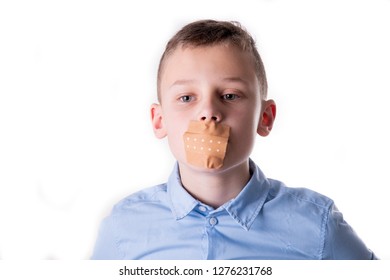 Boy Can't Talk With A Band-Aid Over His Mouth In Blue Shirt