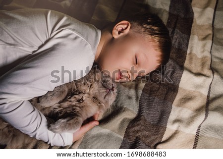 Similar – Newborn baby with pompom hat sleeping on blanket