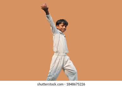 Boy catching cricket ball and celebration