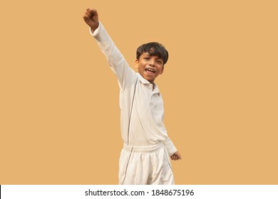 A boy celebration taking a catch During a Cricket Game - Powered by Shutterstock