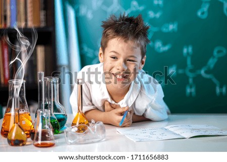 Similar – Image, Stock Photo Happy kig laughing and showing liquid in flask