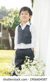 A Boy From Chiang Mai, Thailand In A Polite Suit To Attend A Wedding. With The Light Under The Tree That Looks Too Handsome